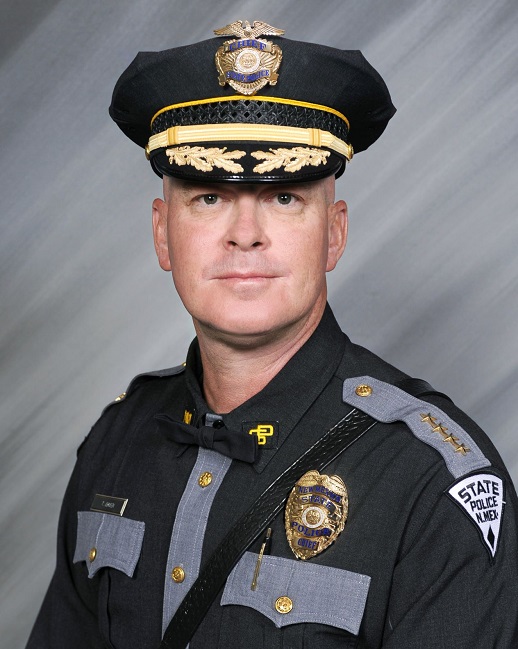 Headshot of man in full uniform